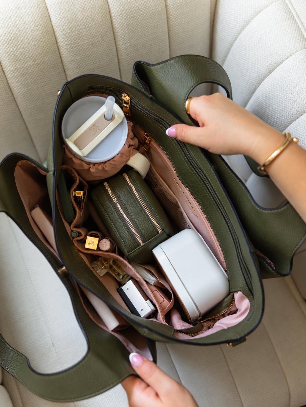 Poppy & Peonies The Companion Tote in Olive overhead interior view, featuring the spacious organized compartments filled with everyday essentials.