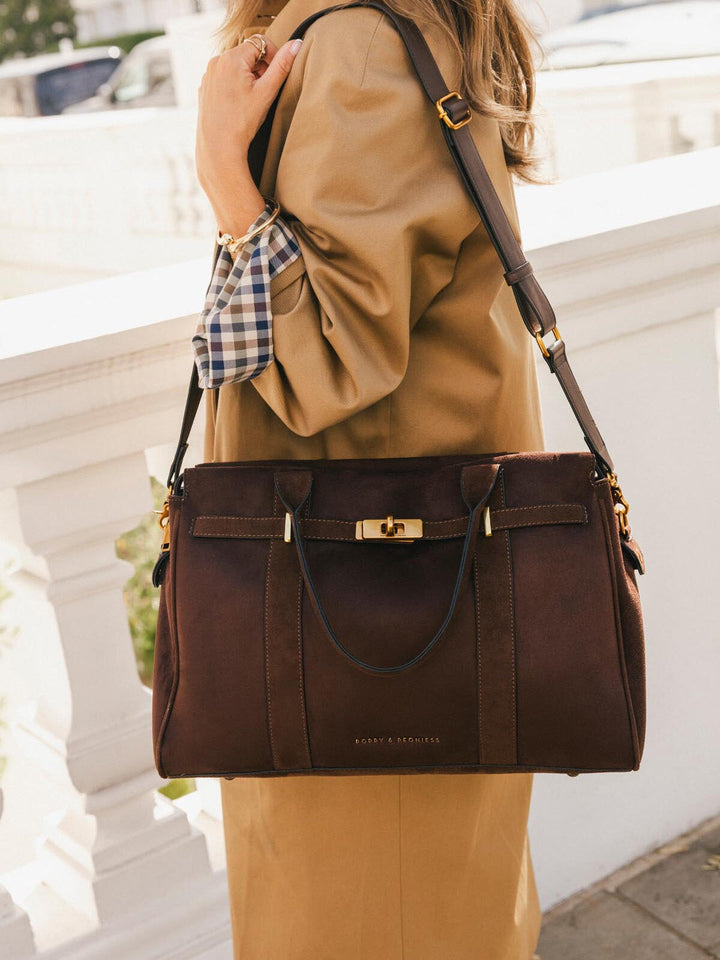 Poppy & Peonies Effortless Tote in Espresso Suede worn with the detachable shoulder strap, showcasing its versatile hands-free carrying option.
