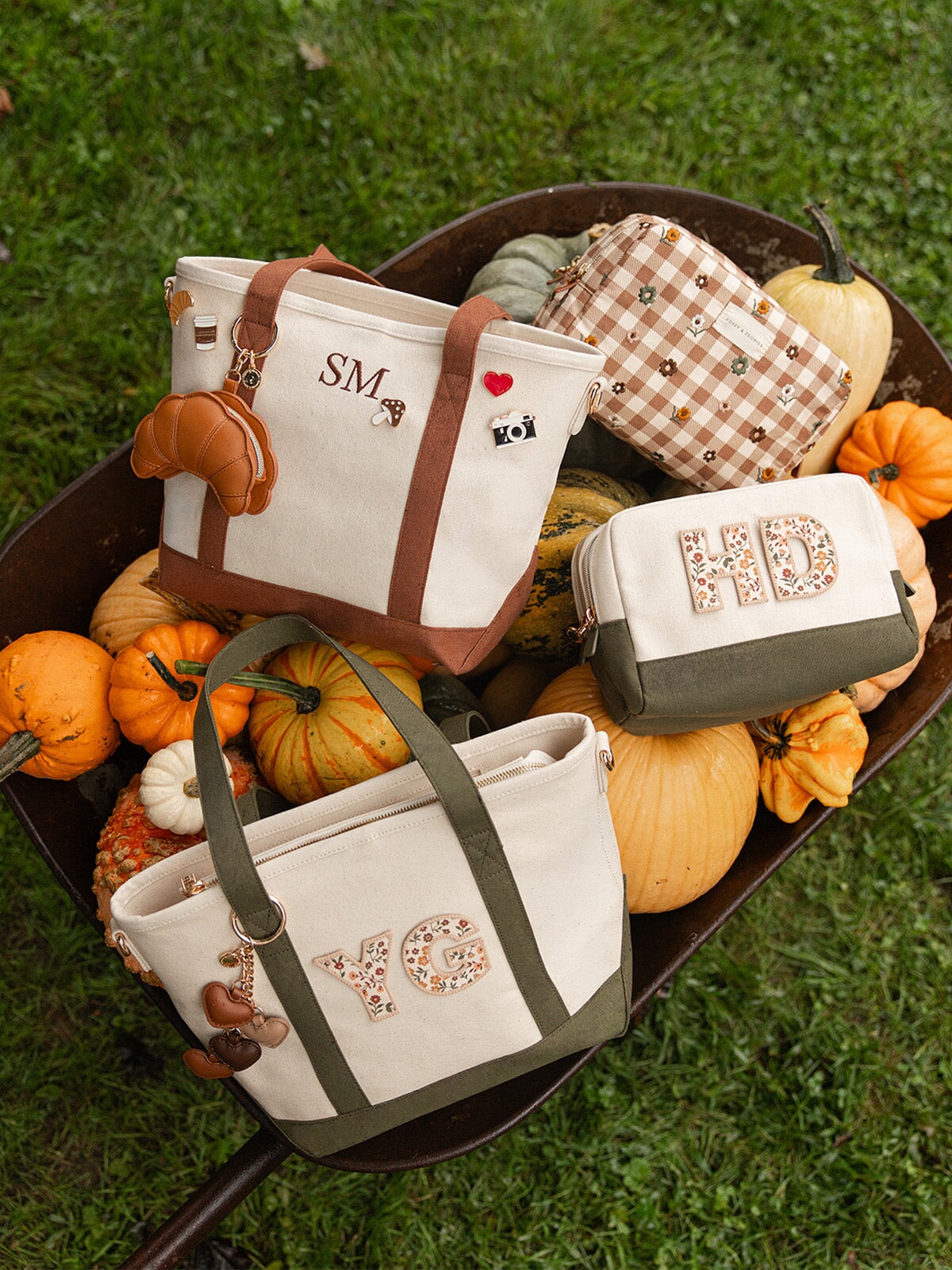Poppy & Peonies Country Cozy Collection featuring personalized canvas totes and cosmetic cases in Chestnut and Olive, arranged among pumpkins and autumn gourds.