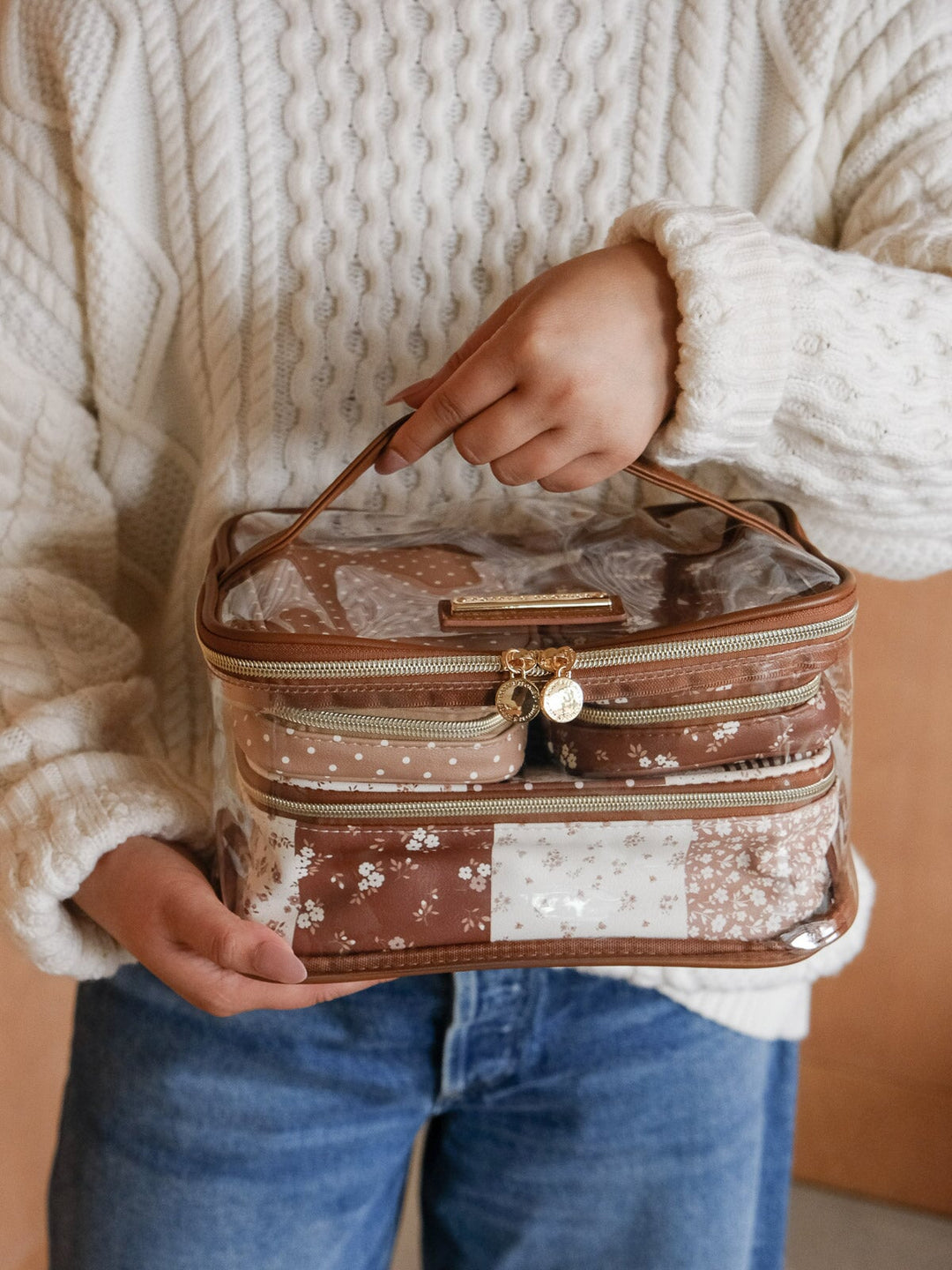 Product-focused shot of the Poppy & Peonies Getaway Cosmetic Set in Brown Patchwork, highlighting its spacious layered design, transparent panels, and easy-carry top handle.
