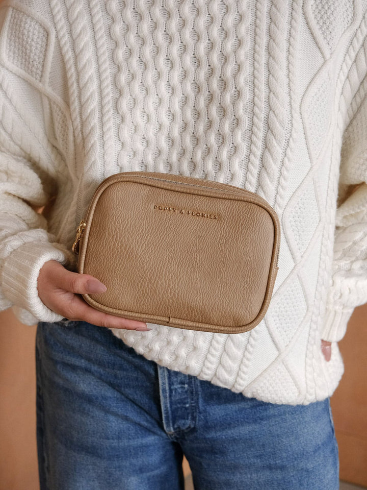 Front view of the Poppy & Peonies Split Organizer in Taupe, showcasing its textured finish, rounded rectangular shape, and subtle gold-tone logo.