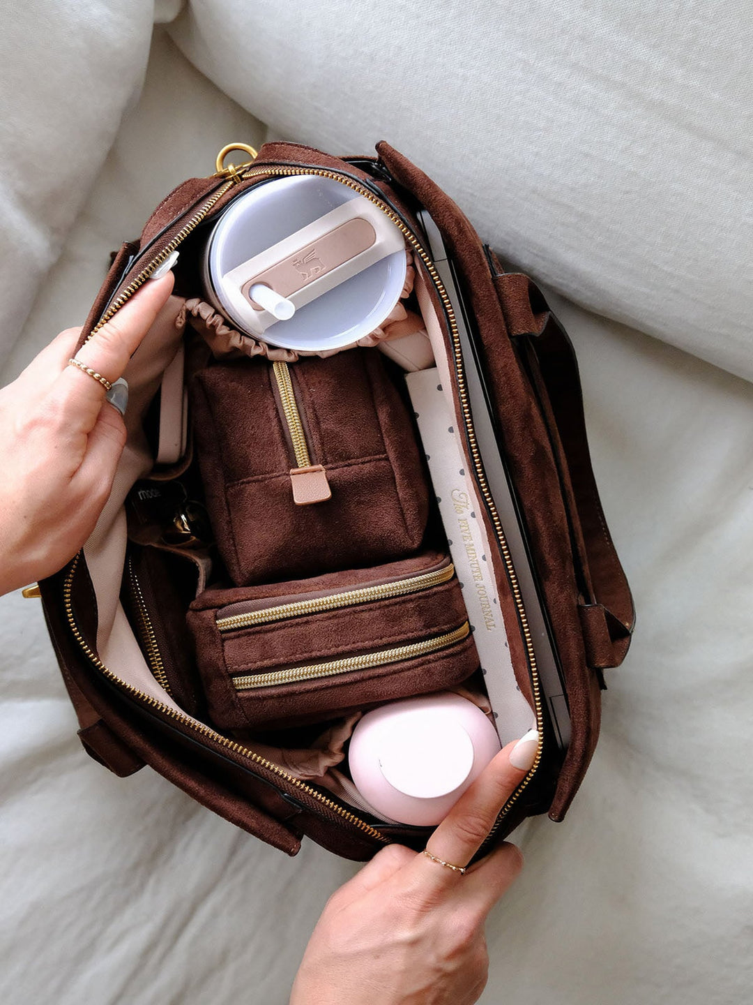 Poppy & Peonies Effortless Tote in Espresso Suede open top view, showcasing the spacious blush interior with organized compartments, zippered pouches, bottle storage and everyday essentials.