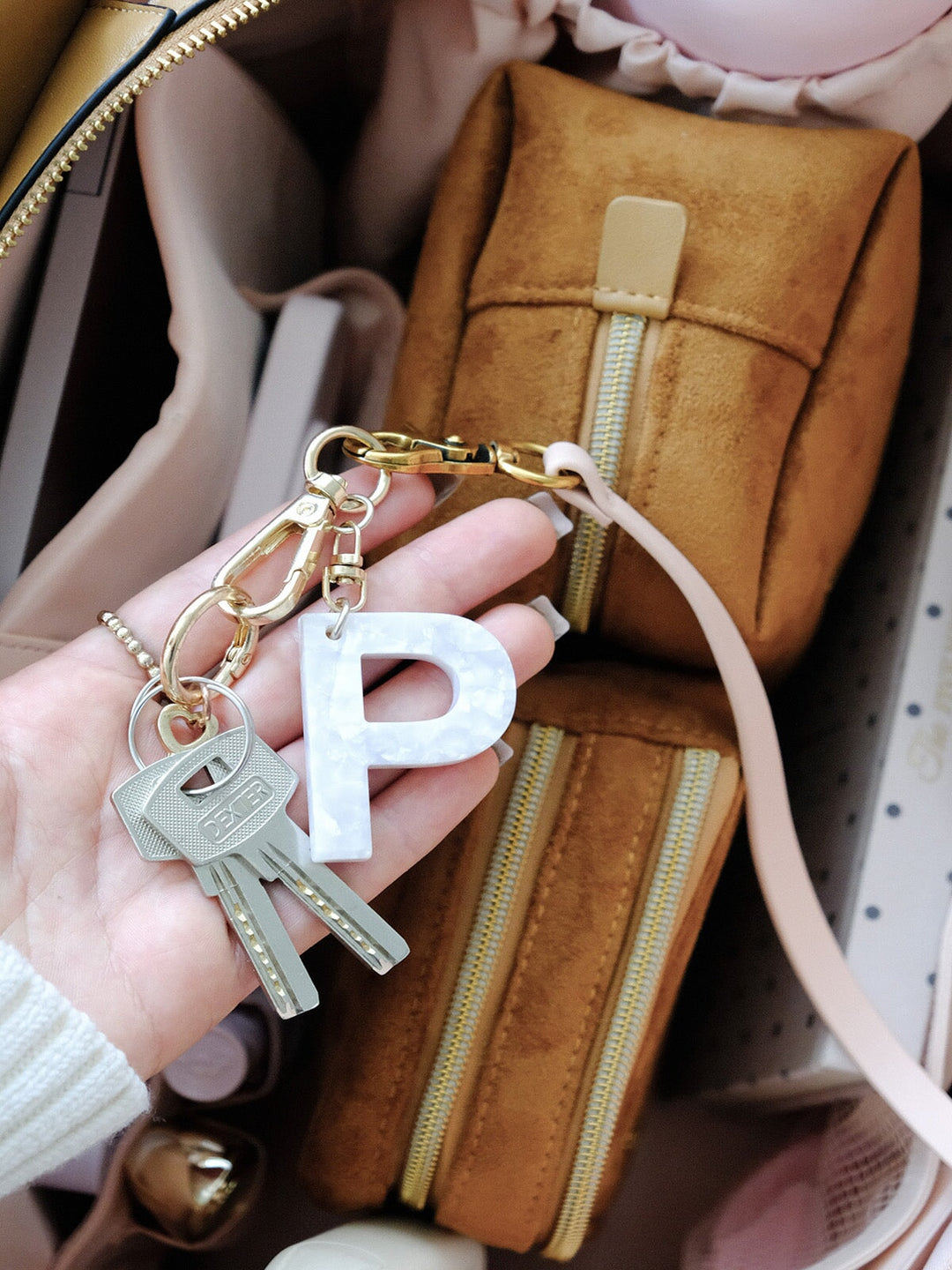 Poppy & Peonies Effortless Tote in Cognac Suede interior close-up, showcasing organized storage with a zippered pouch, key leash with charms and everyday essentials.