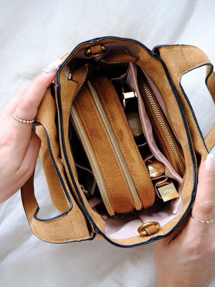 Poppy & Peonies The Pick Me Up Tote in Cognac Suede open top view, showcasing the organized blush interior with zippered compartments, pockets and stored essentials. 