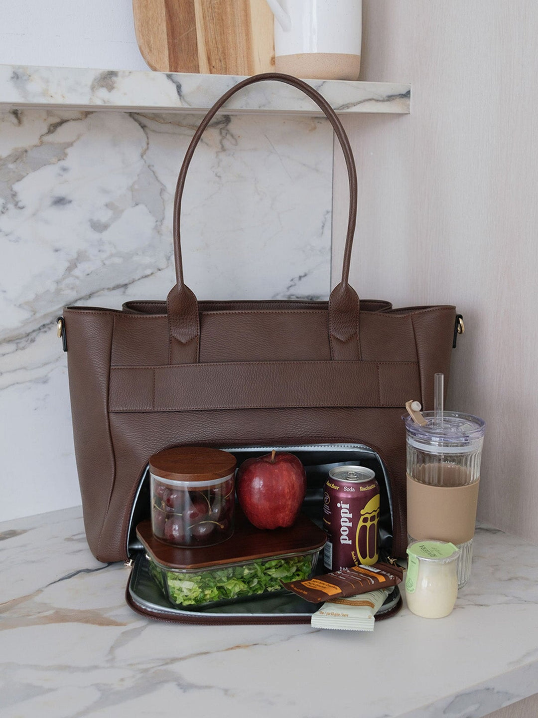 Poppy & Peonies Double Duty Tote in Espresso styled with lunch, snacks and iced coffee, showcasing everyday carry capacity.