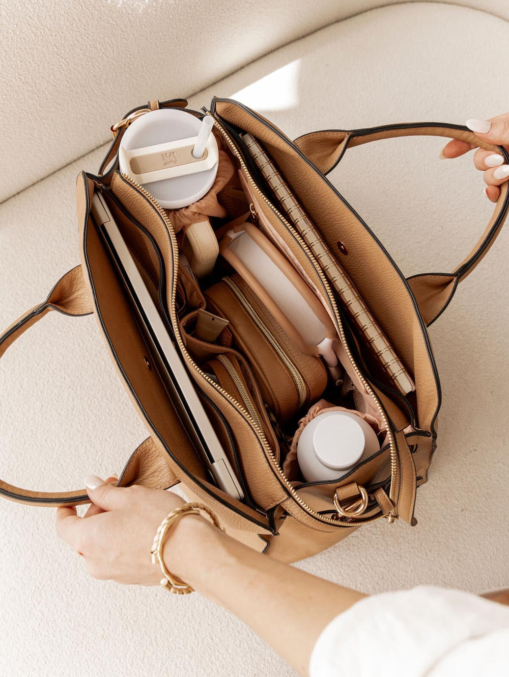 Open mocha mousse handbag on a light background