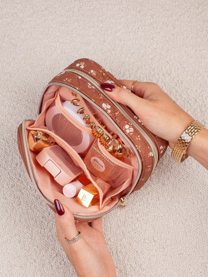 Poppy & Peonies Pretty Connected Case in Brown Floral front view, featuring a quilted brown floral exterior, compact rectangular silhouette and double zip-around compartments.
