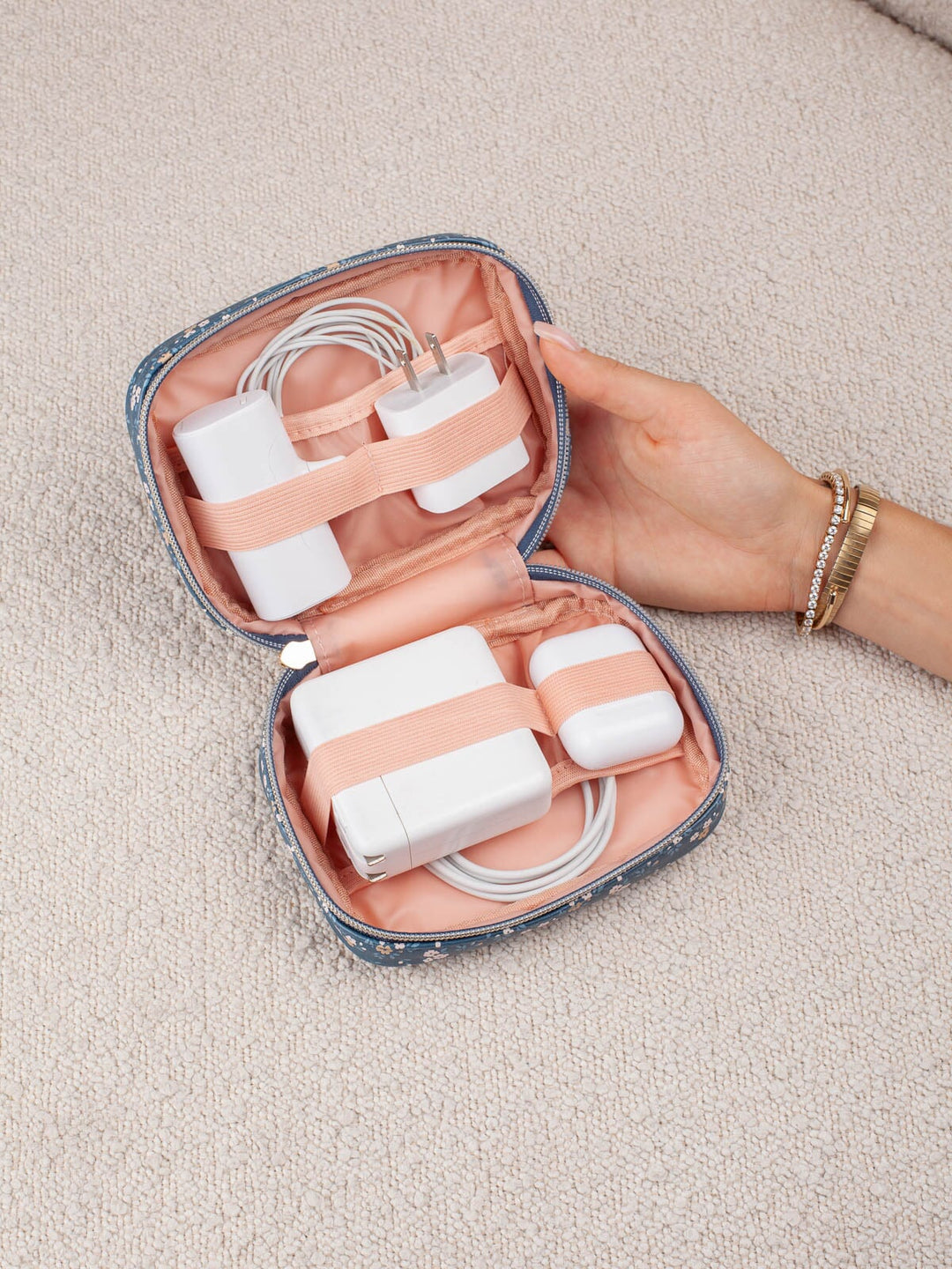 Poppy & Peonies Getaway Cosmetic Set in Navy Patchwork organizer with tech accessories secured inside.