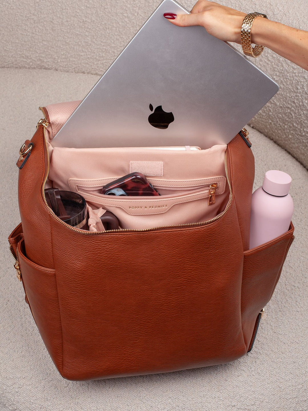 Poppy & Peonies Carryall Backpack in Chestnut with laptop stored in padded interior compartment.