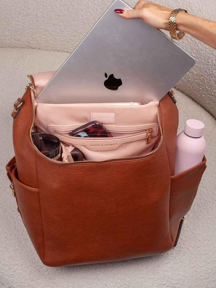 Poppy & Peonies Carryall Backpack in Chestnut with laptop stored in padded interior compartment.