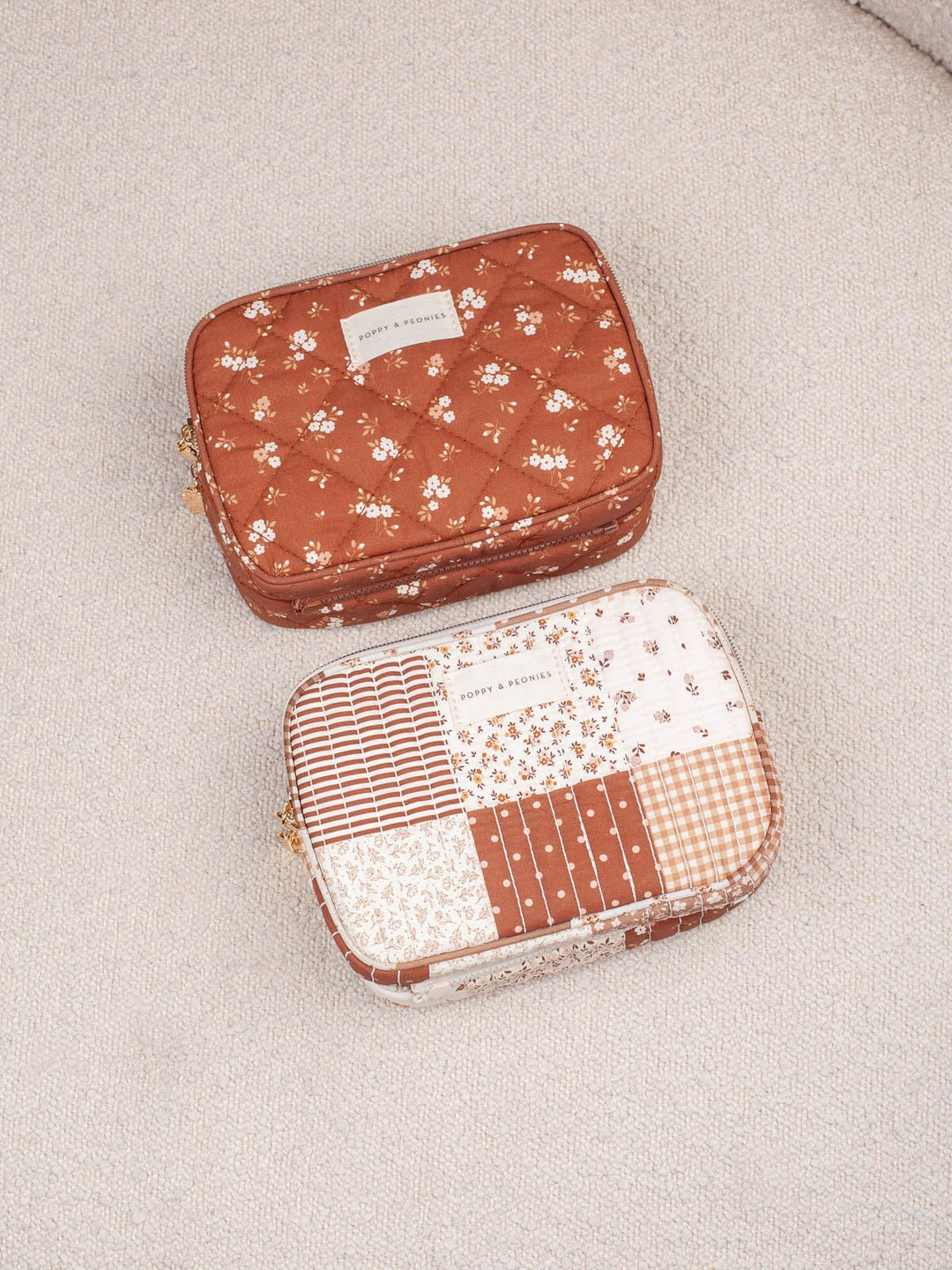 Product shot featuring the Poppy & Peonies The Split Organizer in Brown Floral and Brown Patchwork together, highlighting the coordinating warm-toned floral and patchwork prints.