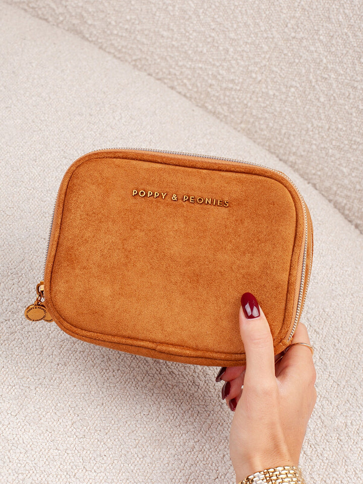 Poppy & Peonies Pretty Connected Case in Cognac Suede front view, featuring a compact rectangular shape, zip-around closure and gold-tone logo.