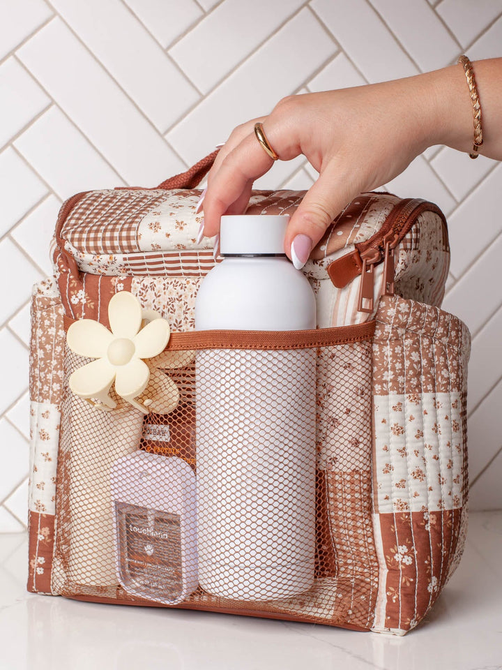 Poppy & Peonies The Lunch Date in Brown Patchwork with top handle, front flap, zippered front compartment, and side pockets.