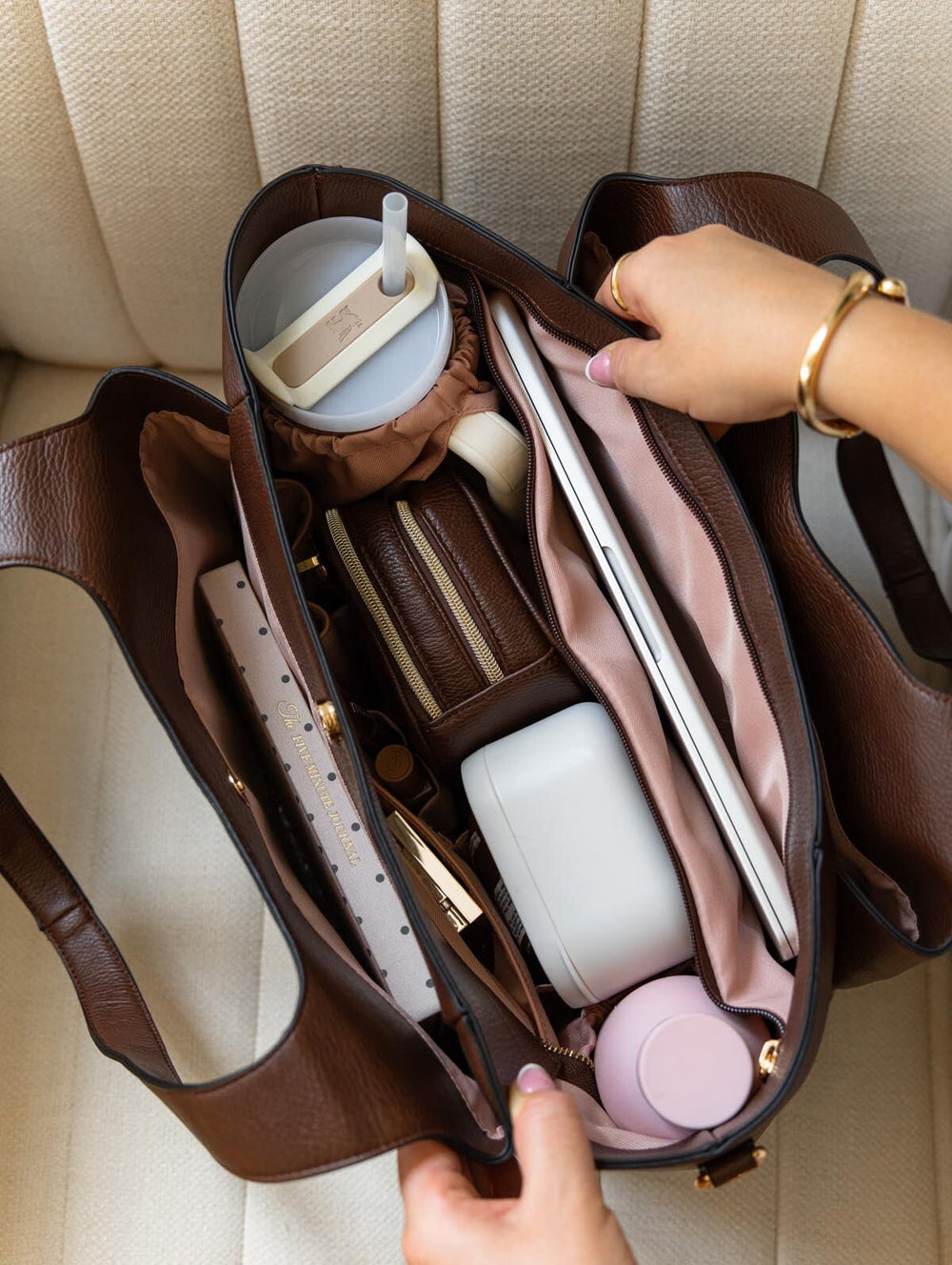 Poppy & Peonies The Companion Tote in Espresso open top view, showcasing the spacious blush-pink lined interior with organized compartments, cupholder and everyday essentials.