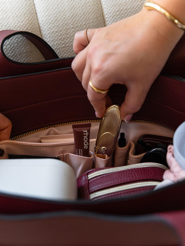 Poppy & Peonies The Companion Tote in Berry interior close-up, showcasing organizational pockets for keeping everyday essentials within easy reach.