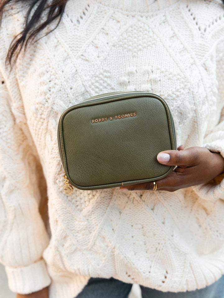 Poppy & Peonies Pretty Connected Case in Olive lifestyle close-up, highlighting its structured zip-around design and gold-tone hardware.