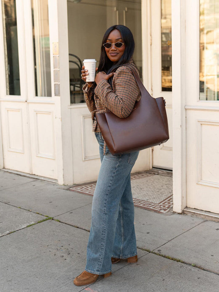 Poppy & Peonies The Companion Tote in Espresso full-length lifestyle view, highlighting its everyday size and shoulder carry.