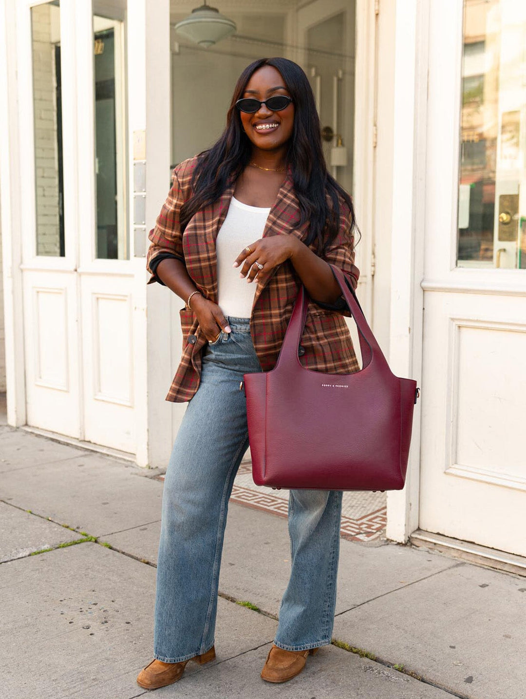 Poppy & Peonies The Companion Tote in Berry carried by the top handles, showcasing its versatile everyday size.