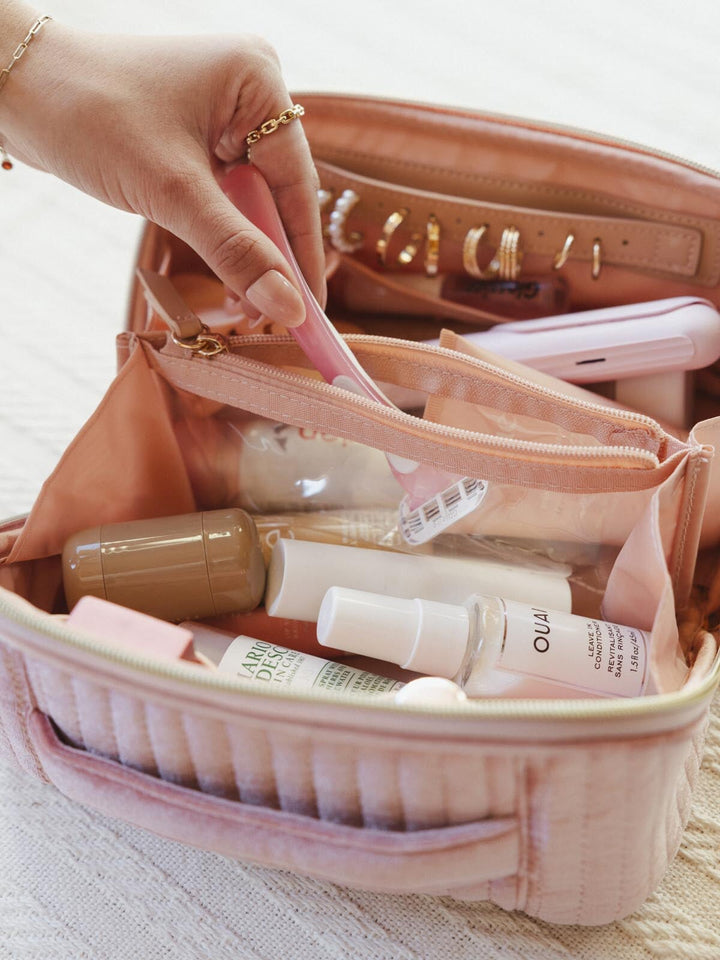 Makeup bag with skincare products and a razor