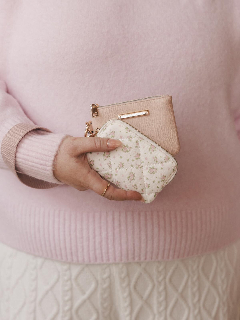 Woman holding two card holders