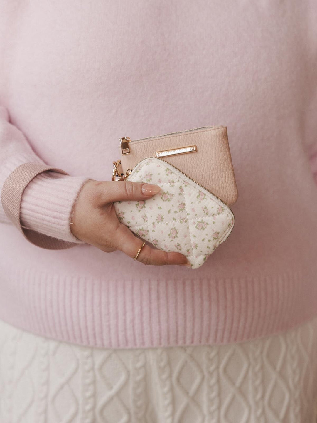 Woman holding two card holders