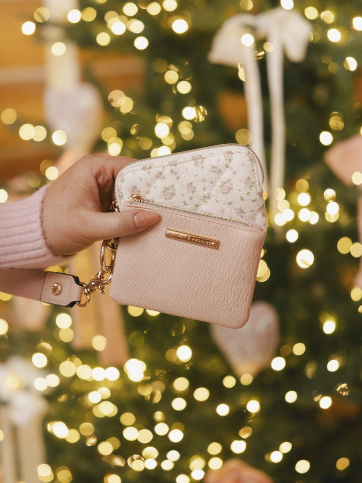a pink and floral car holder