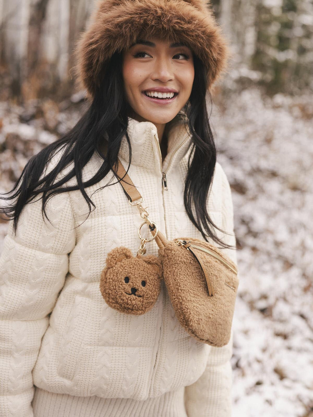 teddy bear bag charm on a faux fur crossbody bag
