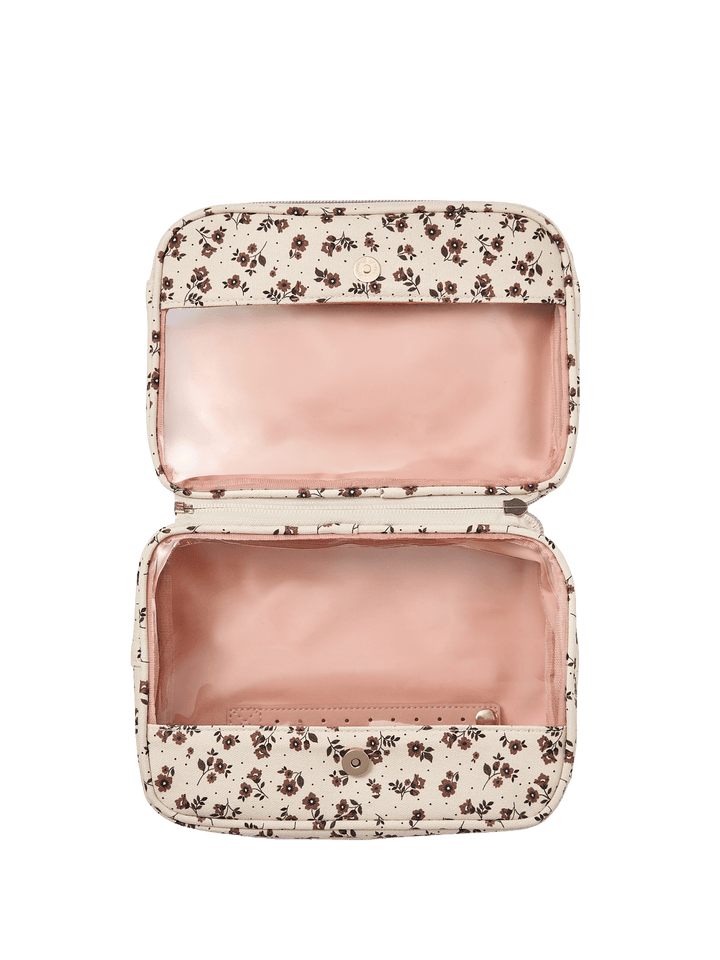Floral-patterned travel case with a pink interior 