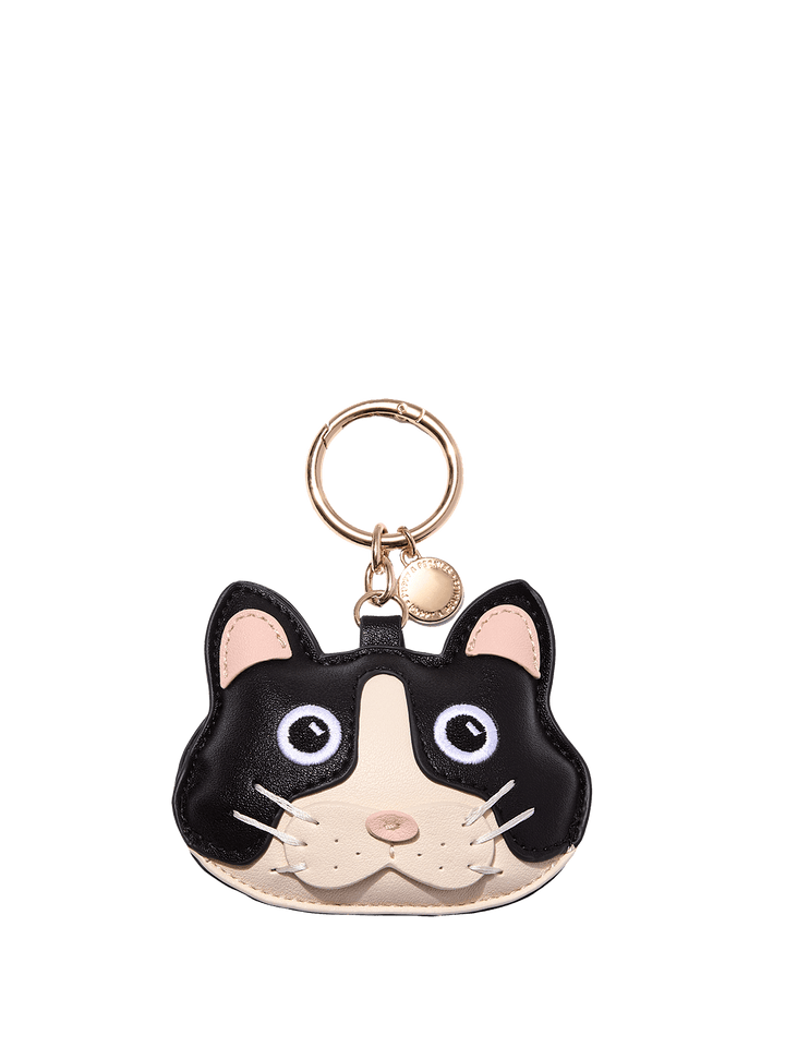 Poppy & Peonies Cat Bag Charm, featuring a playful black and white cat design with a gold-tone key ring and hardware.