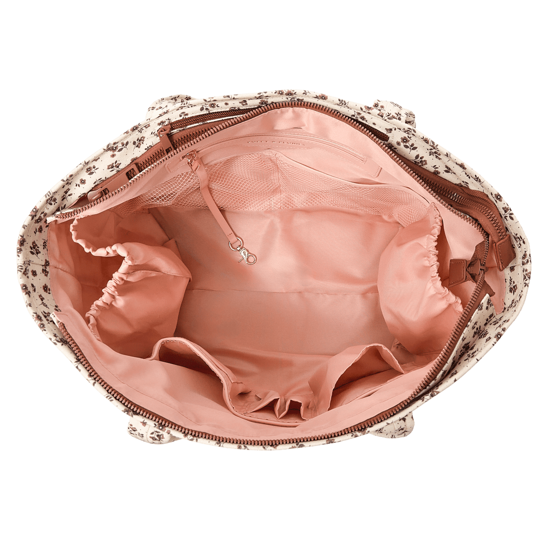 Floral-patterned bag with a pink interior on a transparent background