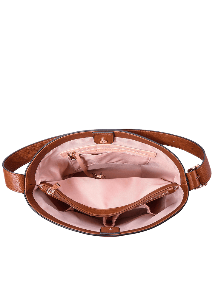 Interior of the Bucket Bag in Chestnut showing zip compartment and organization pockets