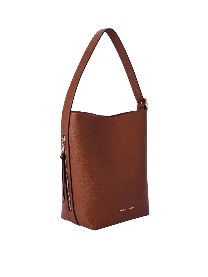 Side profile of the Bucket Bag in Chestnut showing structured silhouette