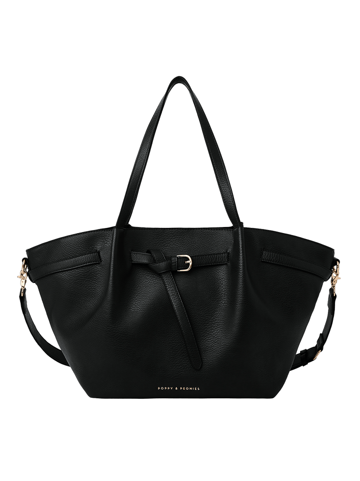 Poppy & Peonies The Knot Tote in Black, featuring a decorative belted buckle, long shoulder handles, and an additional shoulder strap against a white background.