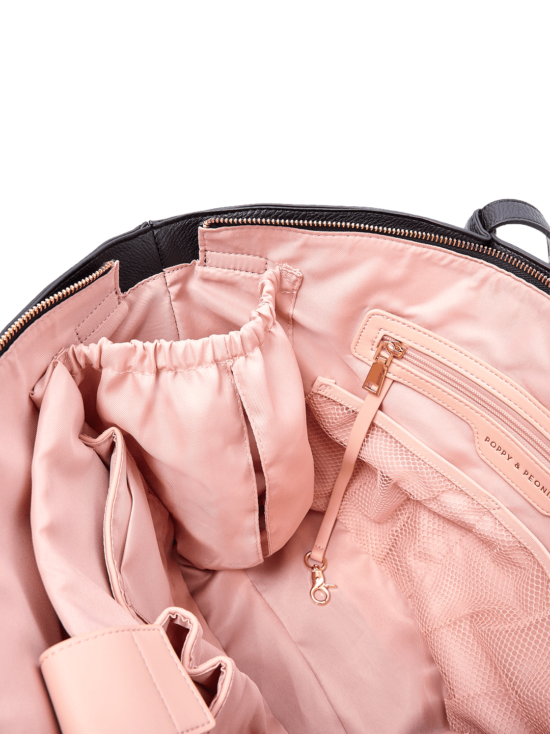 Poppy & Peonies The Knot Tote in Black, showing blush pink lining, a zippered pocket with gold-tone hardware, mesh organizer pockets, and interior storage compartments.