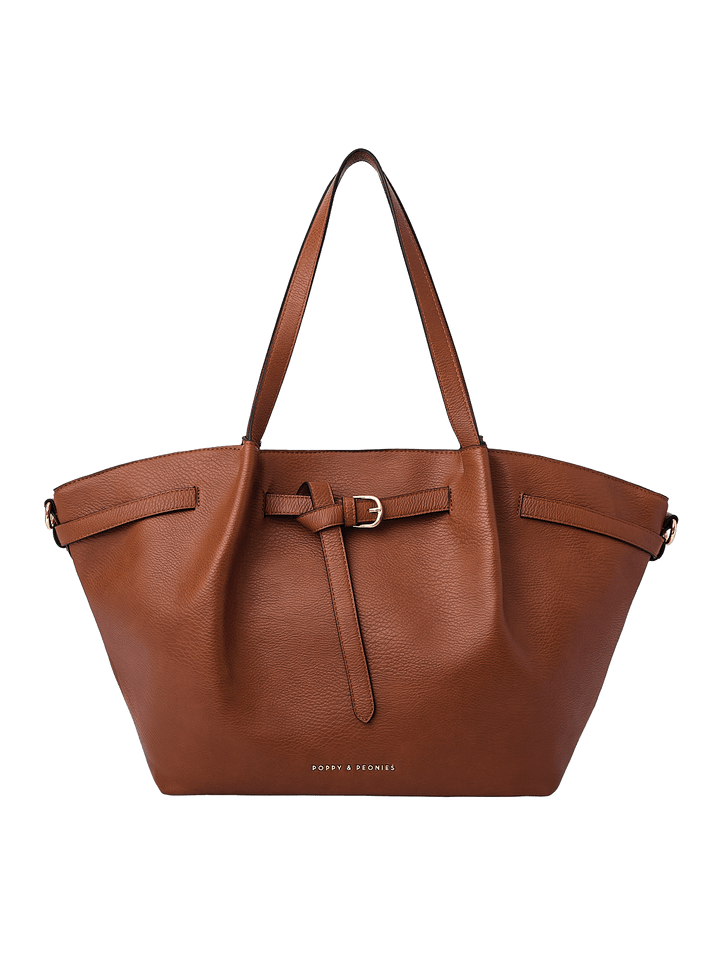 Poppy & Peonies The Knot Tote in Chestnut, featuring a rich brown pebbled exterior, decorative belted detail with gold-tone buckle, long shoulder straps, and a spacious trapezoid silhouette.