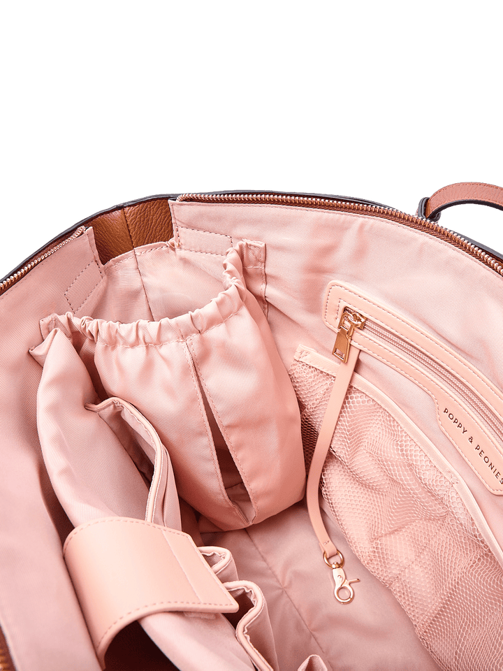Poppy & Peonies The Knot Tote in Chestnut, featuring blush pink interior lining, a zippered pocket with gold-tone hardware, mesh pockets, and organized storage compartments.