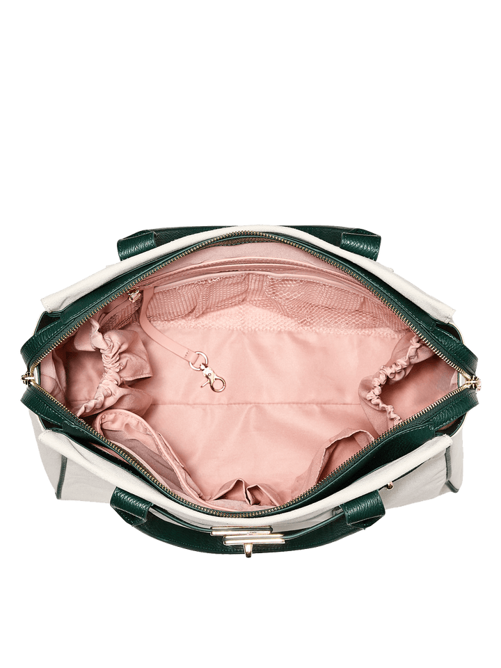 Green and white handbag with pink interior