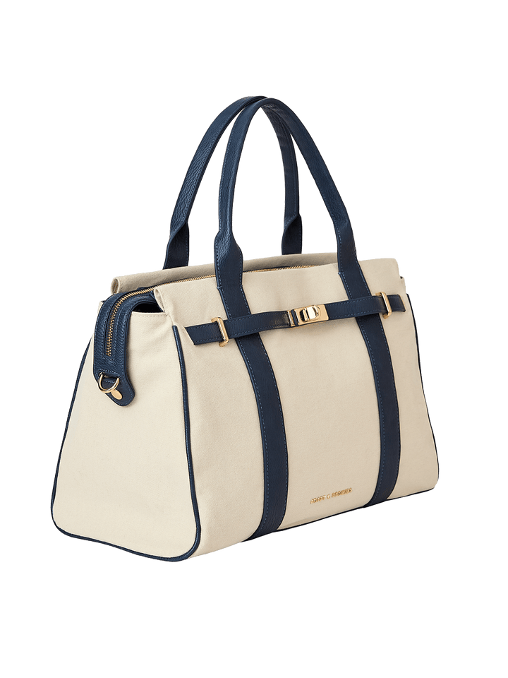Natural canvas and navy handbag with gold hardware