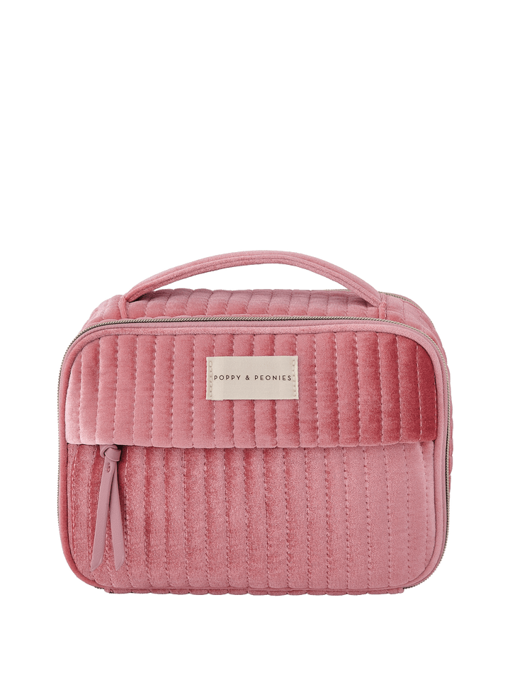 Pink velvet quilted cosmetic bag with a handle