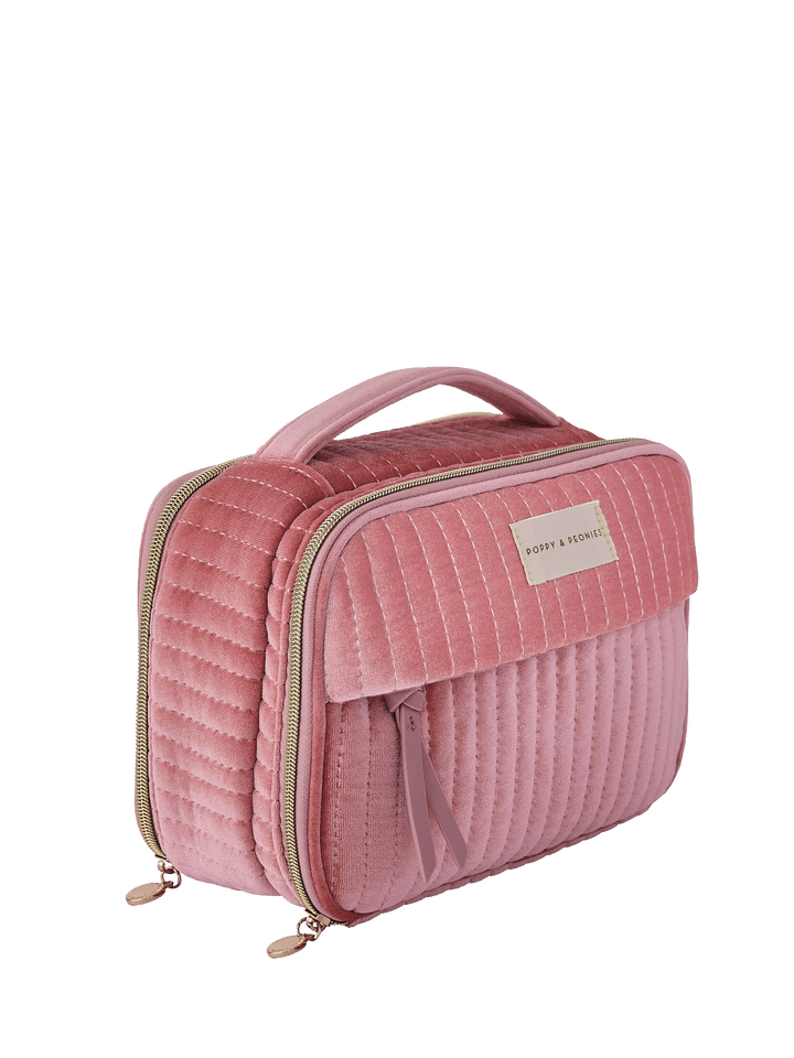 Pink velvet quilted cosmetic bag with a handle