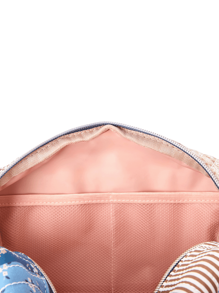 Interior of large Cosmetic Trio pouch in Navy Patchwork showing mesh compartment