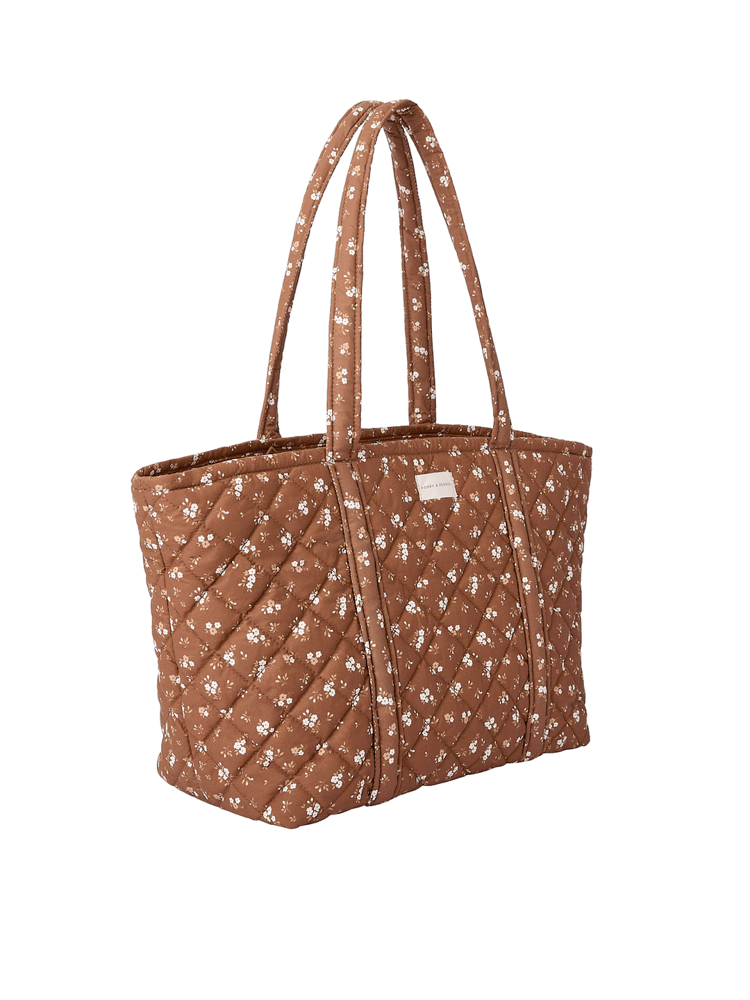 Side profile of the Daydreamer Tote in Brown Floral showing structured quilted design