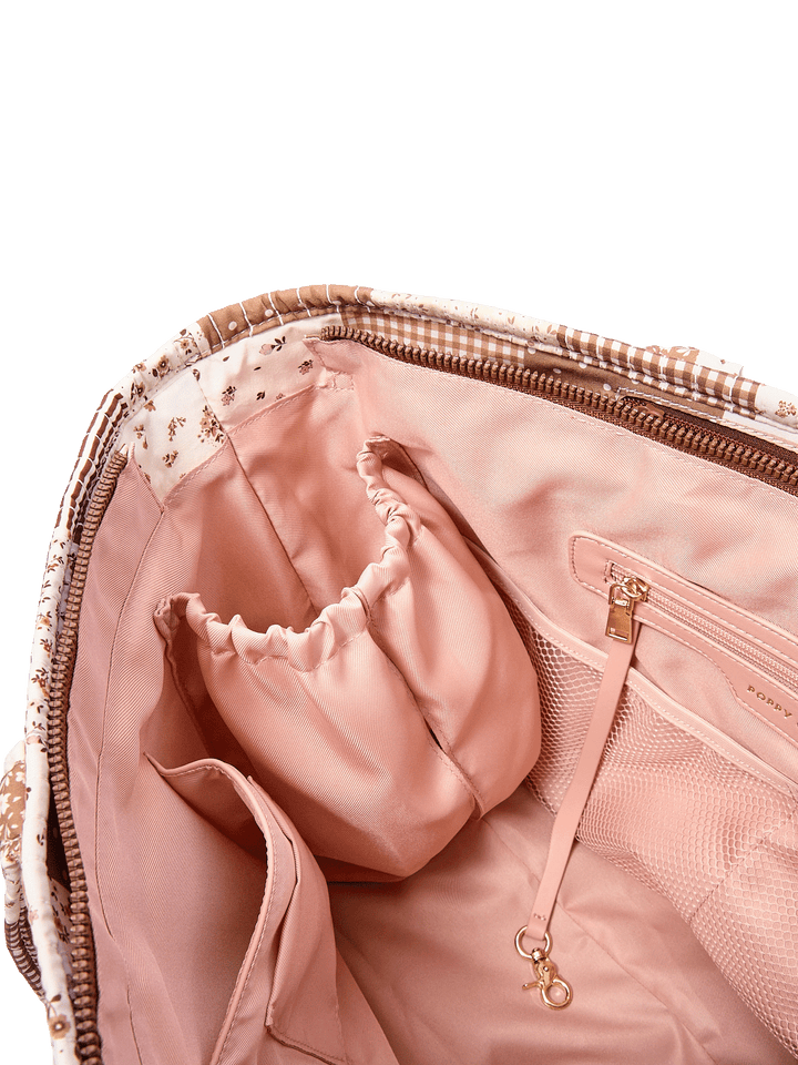 Close-up of the Daydreamer Tote in Brown Patchwork showing interior cup holders and organization pockets