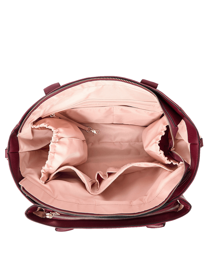 Interior of Double Duty Tote in Berry showing laptop compartment and organization pockets
