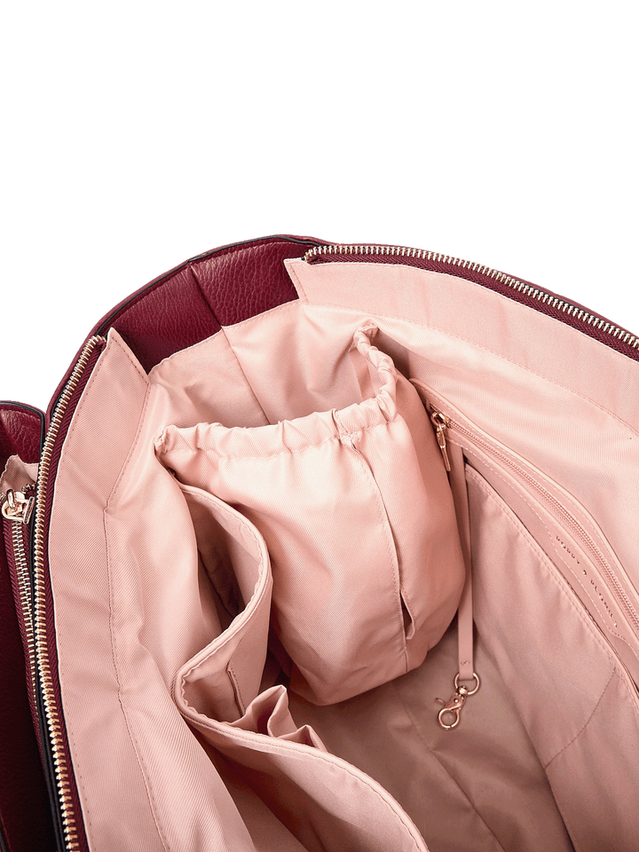 Close-up of Double Duty Tote in Berry showing interior organization pockets and key leash