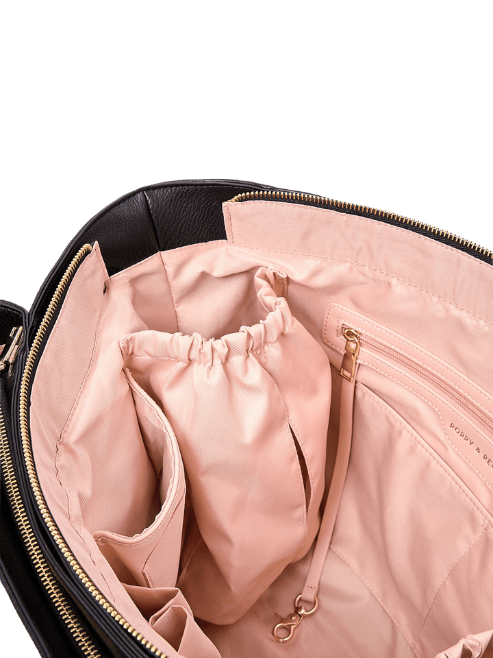 Close-up of Double Duty Tote in Black showing interior organization pockets and key leash