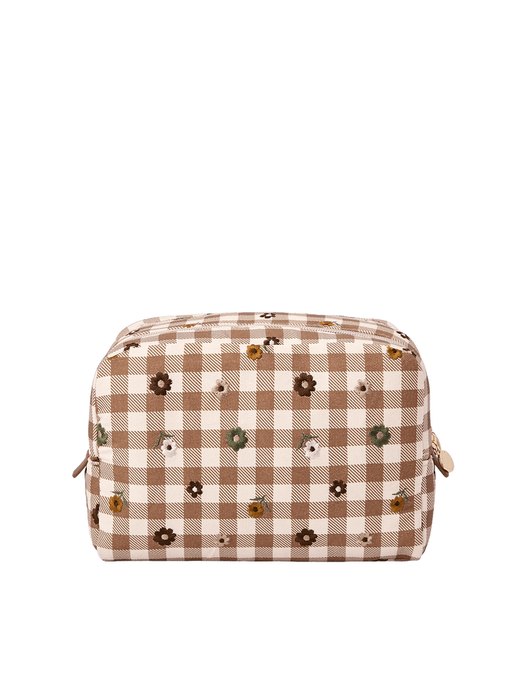 Poppy & Peonies Double Take Cosmetic Case in October Gingham showing the brown and cream checkered canvas exterior with scattered embroidered flowers.