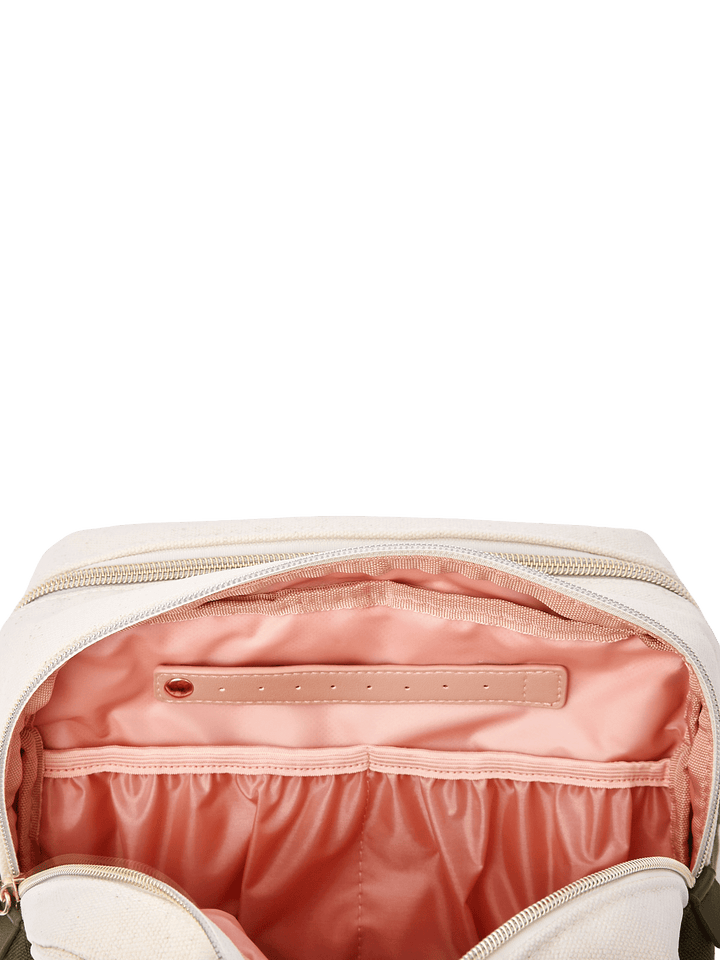 Poppy & Peonies The Double Take Cosmetic in Olive, interior view highlighting the blush-pink lining, zippered pocket, and gathered elastic storage compartments.