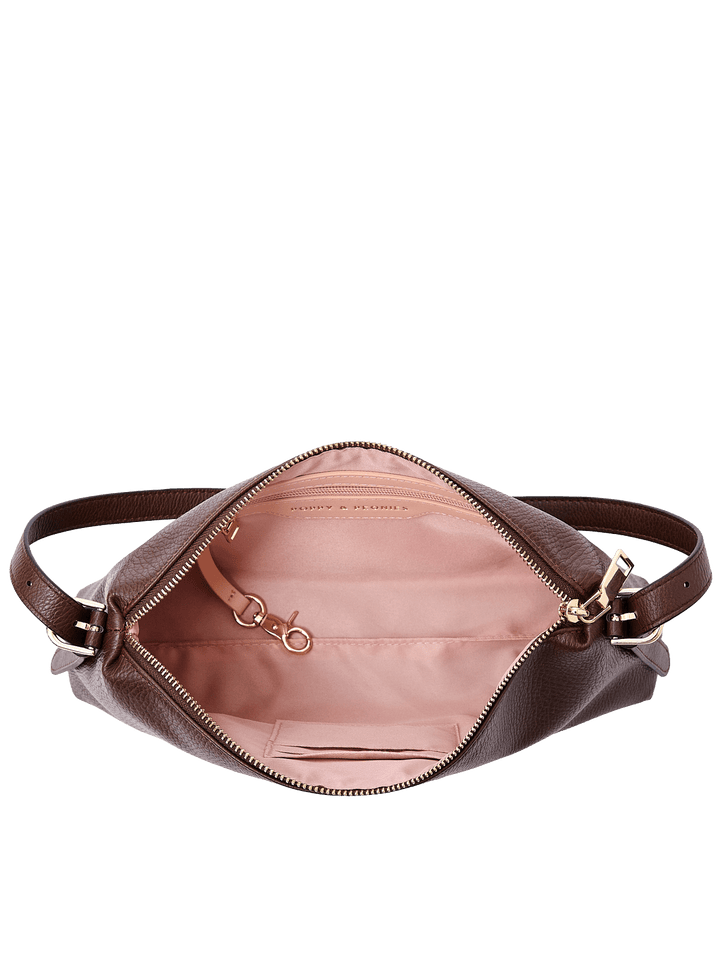 Poppy & Peonies The Soho Shoulder Bag in Espresso, shown open from above with blush pink lining, interior organizer pockets, and a key leash with gold-tone hardware.