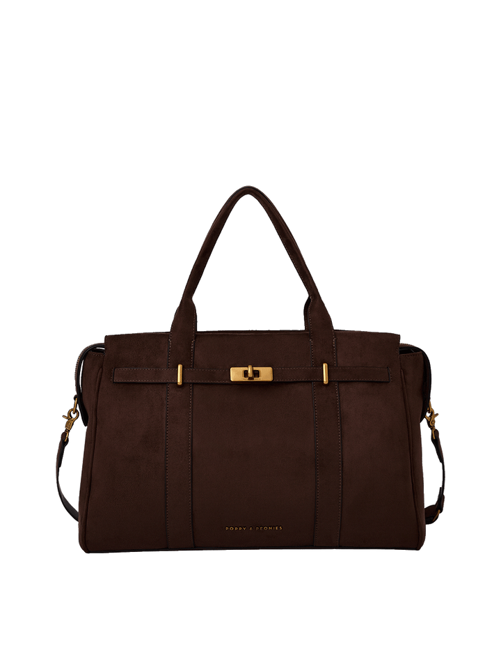 A dark brown suede duffel bag with double top handles, a front strap detail with gold-tone hardware, and a detachable shoulder strap.